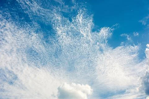 Sun rays in the cloudy sky. Nature background. Stock Photos