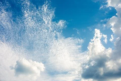 Sun rays in the cloudy sky. Nature background. Stock Photos