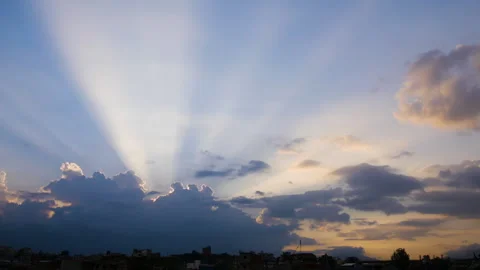 Sun rays coming out from clouds with colorful background of yellowish and or Stock Footage 258637116