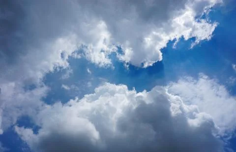 SUN RAYS COMING OUT OF THE CLOUDS Stock Photos