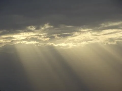 Sun rays coming through the clouds on a December day. In Romania Stock Photos