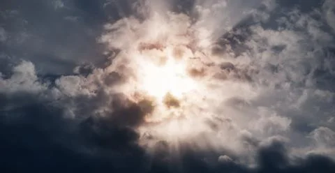 Sun rays in the dark stormy sky Stock-Fotos