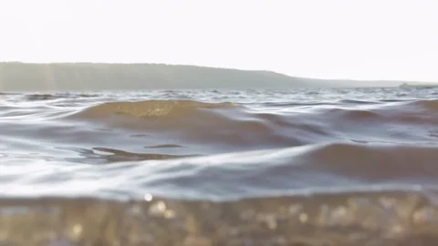 Sun rays emerging through clouds in the middle of the rough exotic 스톡 동영상 133138118