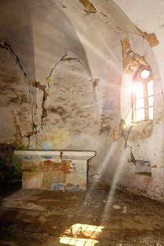 Sun rays entering an abandoned gothic church Stock Photos