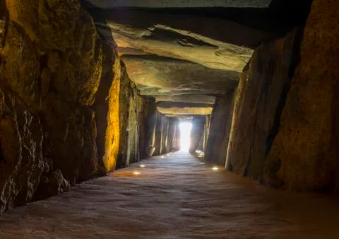 Sun rays entering at Dolmen de Soto chamber. Sun-aligned megalithic monument, Stock-Fotos