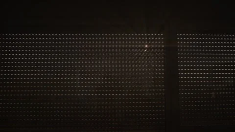 Sun rays entering through small holes in the outer window curtain. Stock Footage 299826014