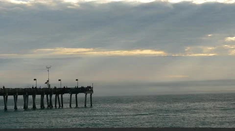 Sun rays on fishing pier time lapse at dusk, 4K Stock Footage 47946767