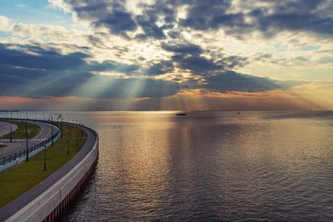 Sun rays goes through the clouds over the Baltic sea, Stock-Fotos