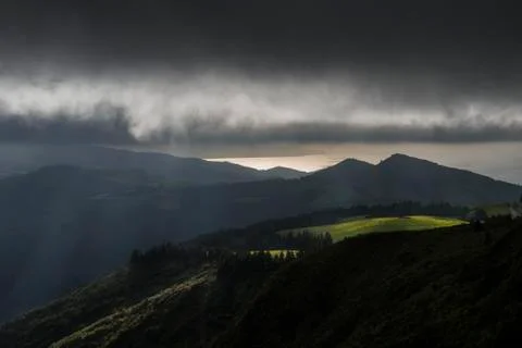 Sun rays illuminating the hills Stock Photos