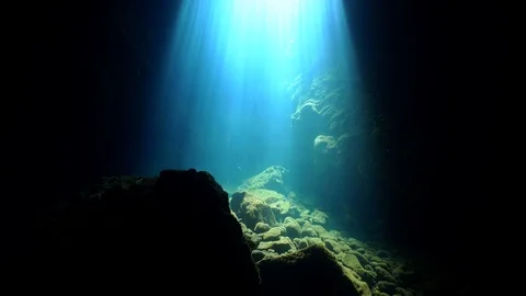 Sun rays inside a cave underwater Stock Footage 127941289