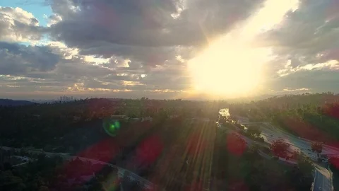 Sun rays light up freeway traffic into Los Angeles California - 4k resolution Stock Footage 127014694