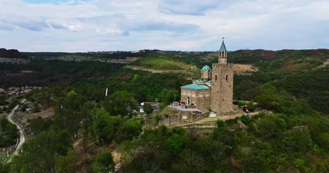 Sun Rays Lighting Aged Church Chapel Of Veliko Tarnovo Bulgarian Flag Aerial Stock Footage 300444871