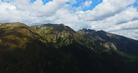 Sun Rays Lighting A Beautiful Mountain Range With Dark Clouds Approaching In The Stock Footage 300446449