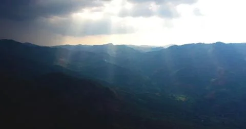 SUN RAYS ON THE MOUNTAINS  WITH CLOUDS Stock Photos