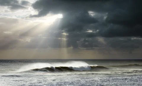 Sun rays on ocean Stock Photos