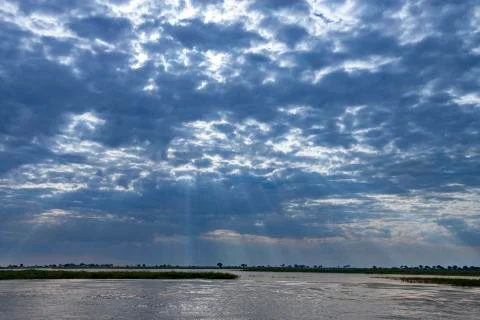 Sun rays over the Chobe River - Botswana Stock Photos