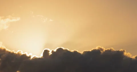 Sun rays over clouds time lapse Stock Footage 99375651