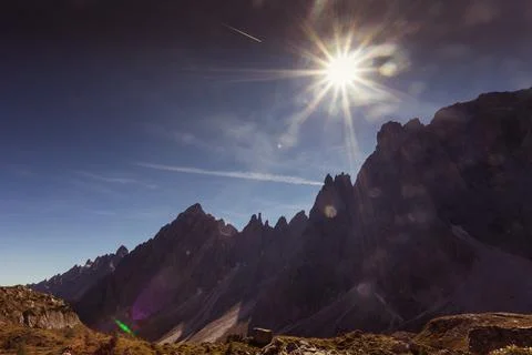 Sun rays over the Dolomite peaks of Popera Mountain in Comelico Region Stock Photos