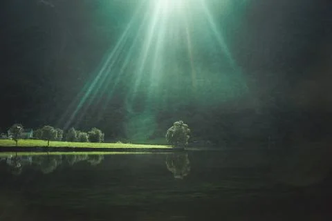 Sun rays over the lake Stock Photos