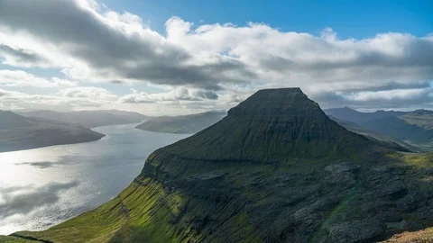 Sun rays over mountain background of ocean 4k timelapse. Faroe islands Stock Footage 124005408