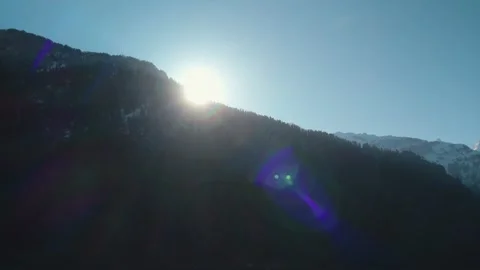 Sun Rays Over Mountain Ridge with Light Beams and Lens Flare Video stock 332547577