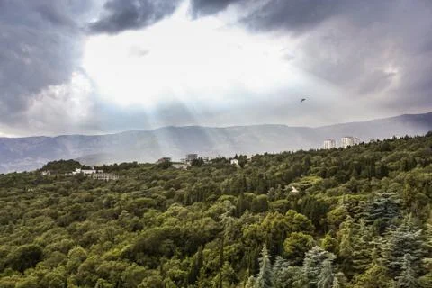 Sun rays over the mountains. Stock Photos