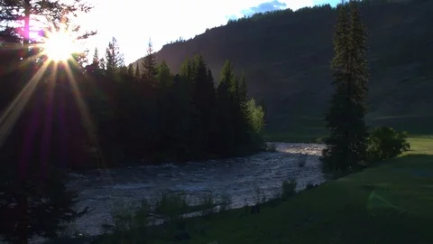 Sun rays over the river, mountain forest cinematic images aerial photography 4k Stock Footage 124055912