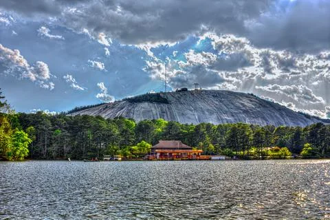 Sun Rays Over Stone Mountain Lake and Granite Dome Stock Photos