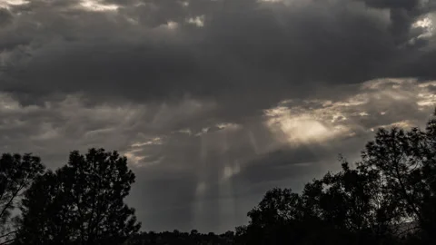 Sun Rays Penetrate through Moving Clouds Time Lapse Stock Footage 280897645