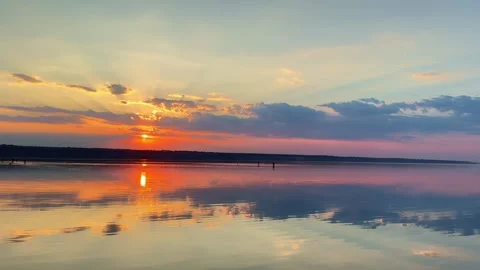 Sun Rays Piercing Clouds Over Reflective Estuary Stock Footage 341756007