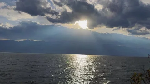 Sun Rays Piercing Through Cloudy Sky Over Erhai Lake, Dali, Yunnan, China Stock Footage 337345669