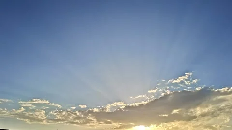 Sun Rays Piercing Through the Evening Clouds Video stock 332940598