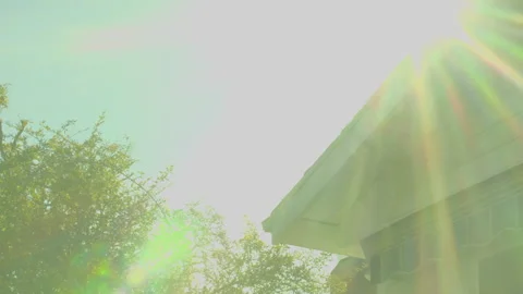 Sun Rays Pour over White House Stock Footage 242565621