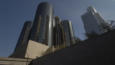 Sun rays reflect in modern skyscrapers in downtown Los Angeles street driving  Stock Footage 99116232