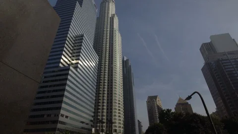 Sun rays reflecting in modern skyscrapers in downtown Los Angeles dolly shot Stock Footage 99117157