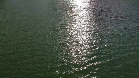 Sun rays reflections on the water surface Stock Footage 91197567