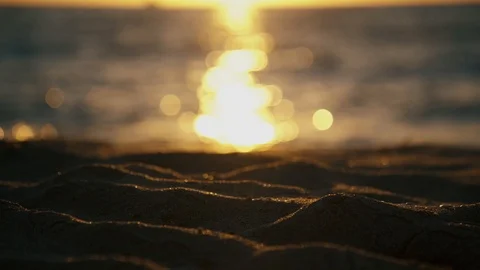 Sun rays relfecting of waves and sand Stock-Footage 124751336