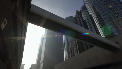 Sun rays shine next to modern skyscrapers in downtown Los Angeles street  Stock Footage 99117176