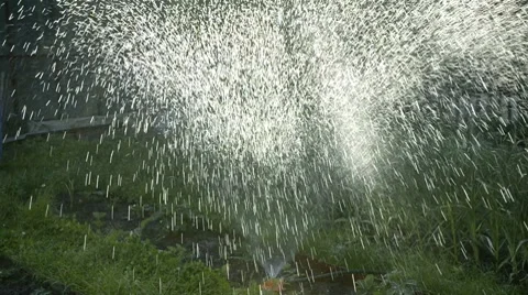 Sun rays shine through the sprayed water drops Stock Footage 7131278