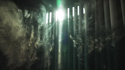 Sun rays shine through the vertical blinds on the window into the dark smoke 库存影片 294668106