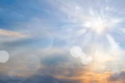 Sun rays shining brightly in sky Stock Photos