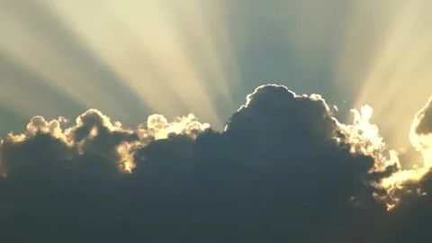 Sun rays shining through dark clouds at sunset Stock Footage 335952845