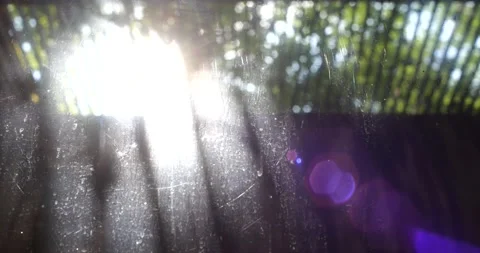 Sun rays shining through dirty glass window into the building basement Vídeos de archivo 197405490