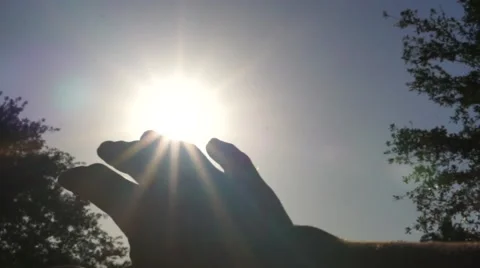 Sun Rays Shining Through Fingers Video stock 62957129