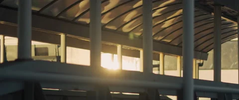 Sun rays shining through an old boat in a city port at sunset. Stock Footage 147565473