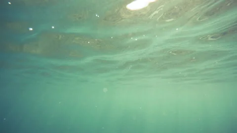 Sun rays sun beams underwater. Underwater shot of ecosystem and ocean floor in Stock Footage 130992379