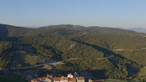 Sun rays of a sunset cover the old town of Chodos in orange colors Stock Footage 125615785