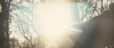 Sun rays thorugh fingers, anamorphic blue flares, winter sun Stock Footage 253011521