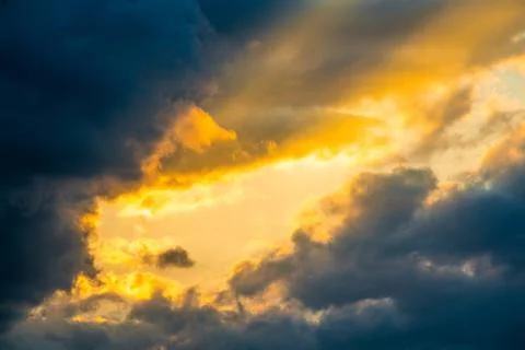 Sun rays through clouds like an dramatic explosion Stock Photos