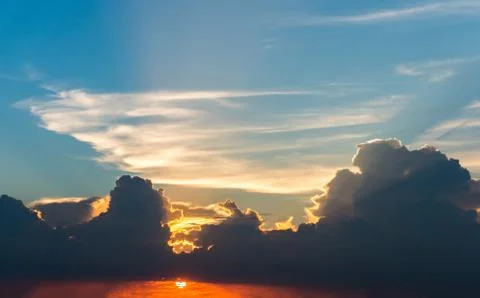 Sun rays through clouds like an dramatic explosion Stock Photos